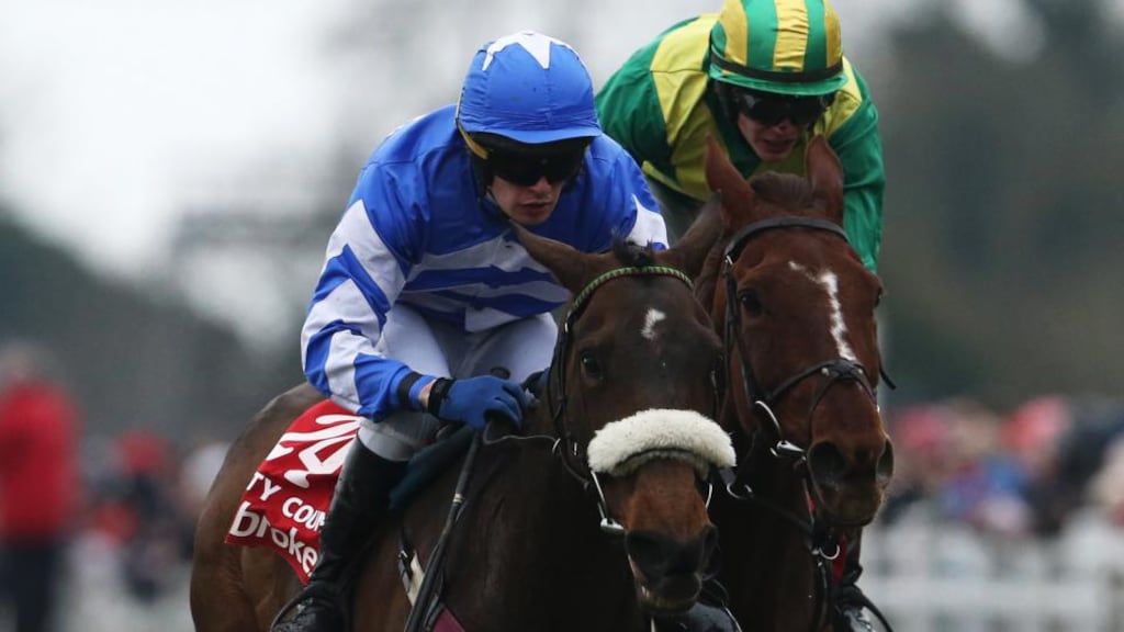 Jockey Ben Dalton aboard Liberty Counsel (left) on his way to winning the Irish Grand National last year leaves jockey Paul Townend on Away We Go in his wake. Photograph: Cathal Noonan/Inpho