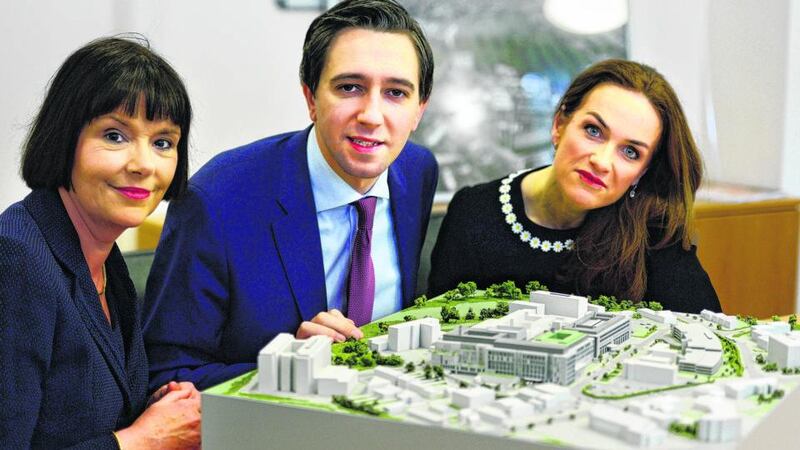 Chief operations officer Kay Connolly, Minister for Health Simon Harris and former master of the National Maternity Hospital Dr Rhona Mahony with a model of the new NMH at St Vincent’s University Hospital. Photograph: Cyril Byrne