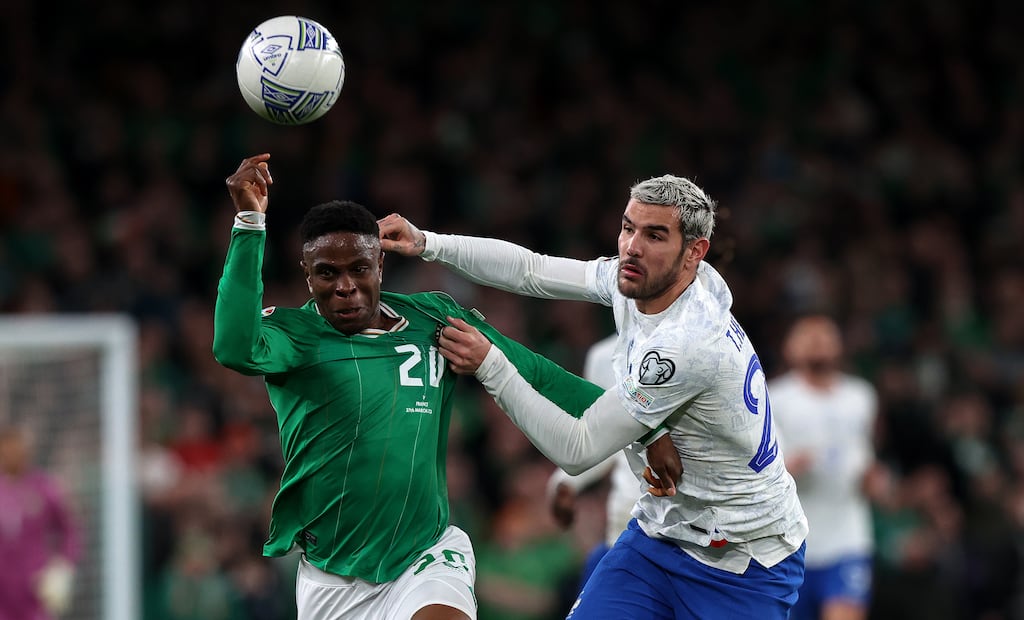 Chiedozie Ogbene in action against Theo Hernández during Monday night's qualifier. Photograph: Morgan Treacy/Inpho