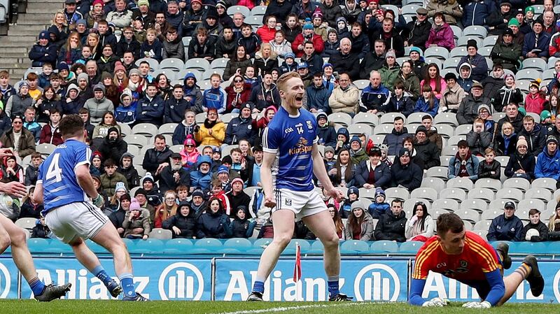 Cavan’s Adrian Cole celebrates Enda Flanagan scoring a goal in the Division Two final. Photograph: Inpho/Bryan Keane
