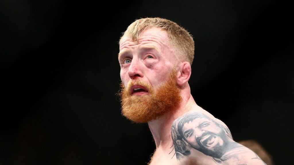 Paddy “The Hooligan” Holohan dejected after losing his UFC fight against Louis Smolka. Photograph: Cathal Noonan/Inpho