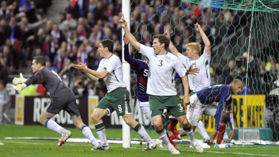 Irish players rush to the referee after the handball incident. Photograph: Getty