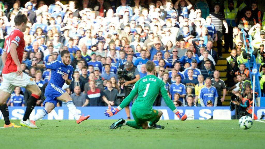 Eden Hazard scores Chelsea’s goal in the Premier League clash against Manchester United at Stamford Bridge. Photo: Facundo Arrizabalaga/EPA