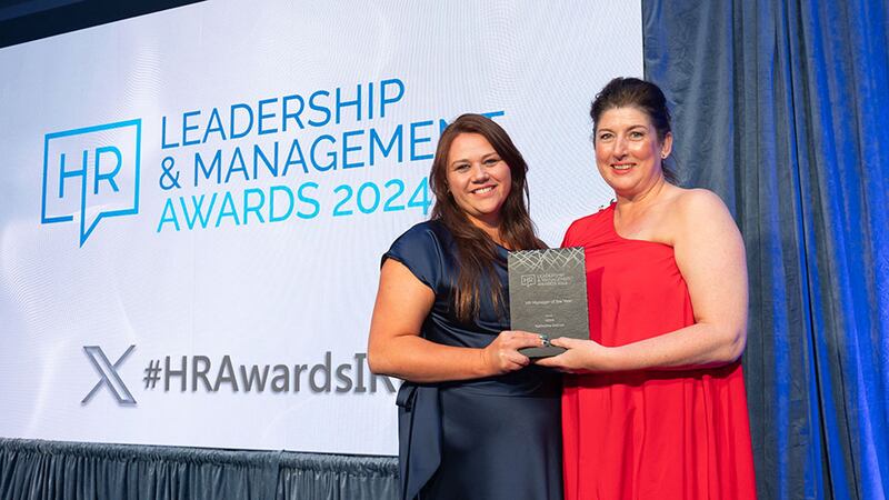 Crystel Robbins Rynne, HRLocker, presents the HR manager of the year award to Katherine Durcan, Voya