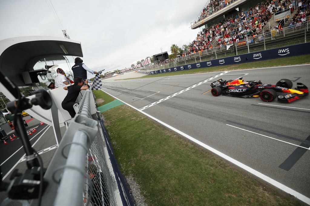 Max Verstappen crosses the finish line to win the Spanish Grand Prix at the Circuit de Catalunya. Photograph: Albert Gea/AFP via Getty Images
