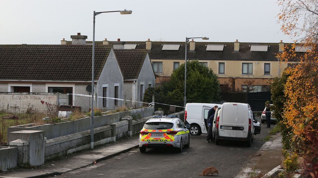 Gardaí at Parslickstown Gardens in Blanchardstown where an infant, a teenager and a woman were injured in a shooting on Monday. Photograph: Niall Carson/PA Wire.