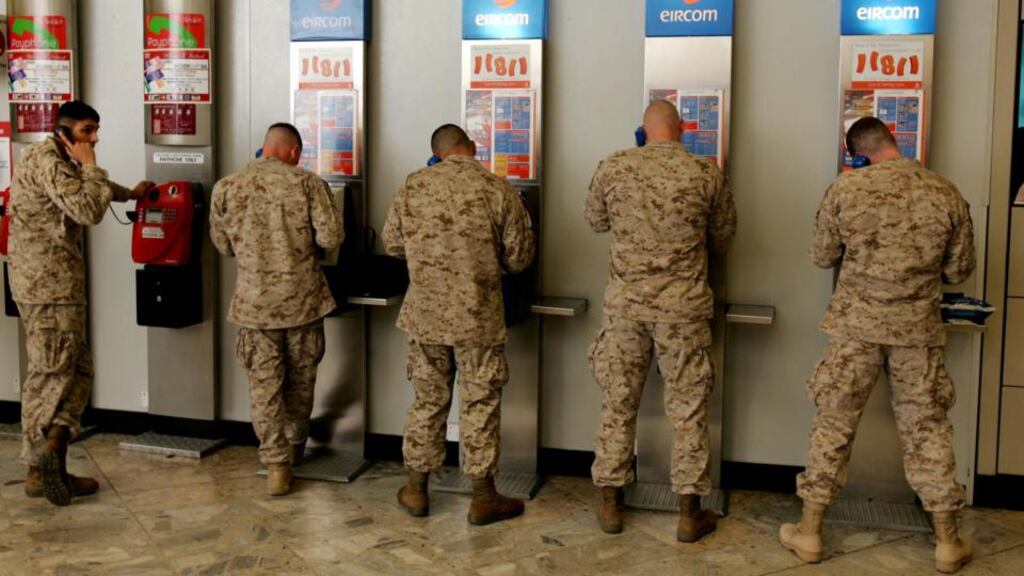 US Marines bound for Iraq call home shortly after arriving in Shannon. Photograph: Matt Kavanagh/The Irish Times