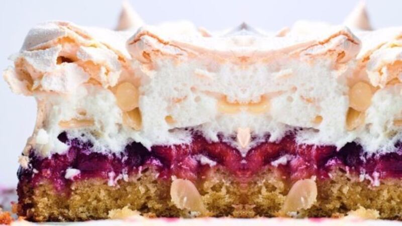 Louise cake with plums and coconut, and a meringue topping