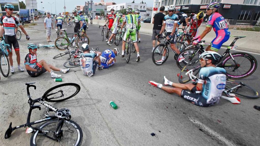 Riders and their bicycles fill the road after a fall in the last 5 kilometers of the 213km first stage of the centenary Tour de France from Porto-Vecchio to Bastia, on the French Mediterranean island of Corsica. Photograph: Eric Gaillard/Reuters