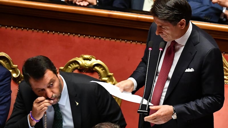 Italian prime minister Giuseppe Conte, flanked by peputy prime ministers Matteo Salvini (left) and Luigi Di Maio, addresses the Senate in Rome on Tuesday. Photograph: Ettore Ferrari/EPA