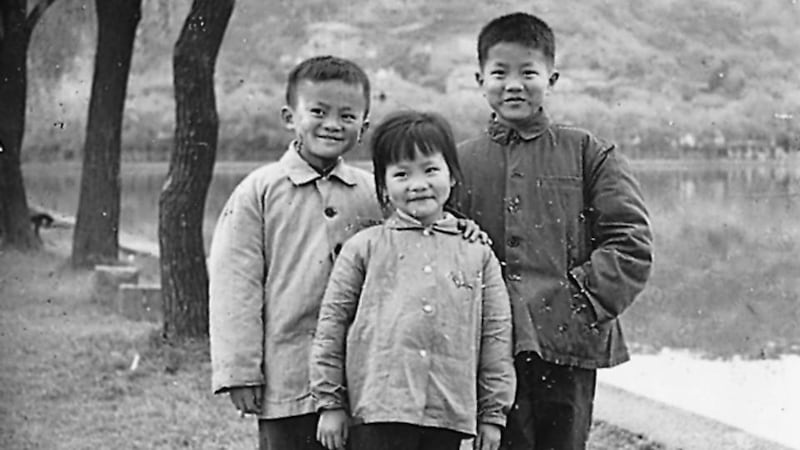 In an undated family photo, Jack Ma, far left, and siblings by the famed West Lake in their home city of Hangzhou, China.