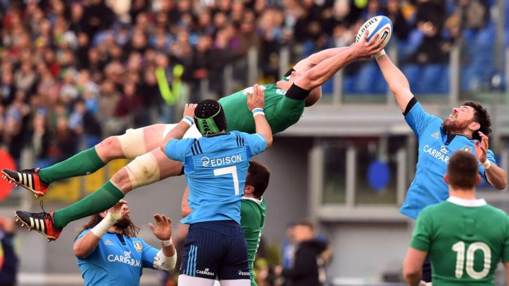 Ireland’s Paul O’Connell makes a spectacular catch in the lineout ahead of Italy lock George Biagi. Photograph: Gabriel Bouys/AFP/Getty Images