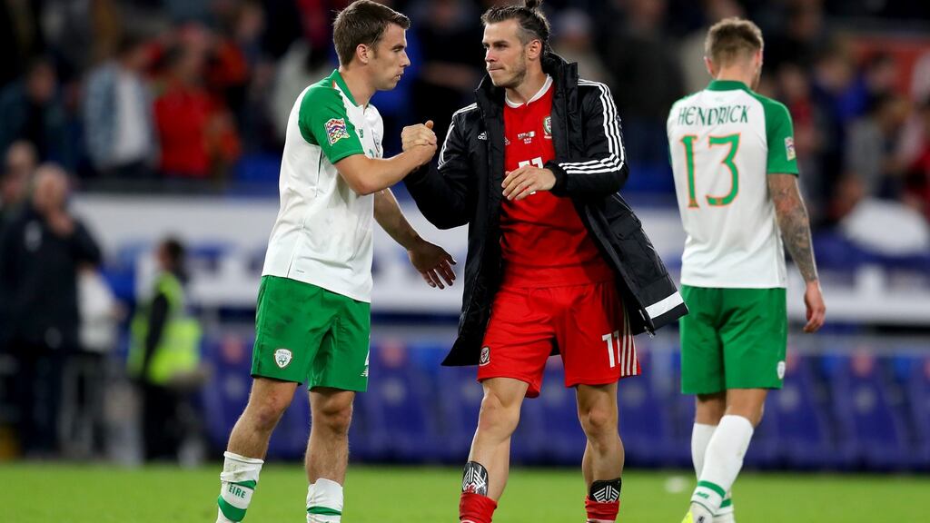 Seamus Coleman and Gareth Bale shake hands after the match at Cardiff City Stadium. Photograph: Getty Images