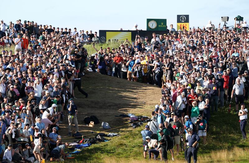 Rory McIlroy plays into the 17th green from the crowd during Day Three of The 153rd Open Championship at Royal Portrush. Photograph: Richard Heathcote/Getty Images