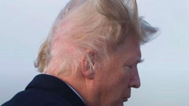 The video clip shows Donald Trump’s struggle to keep whatever hair substance is on his head attached to the scalp
