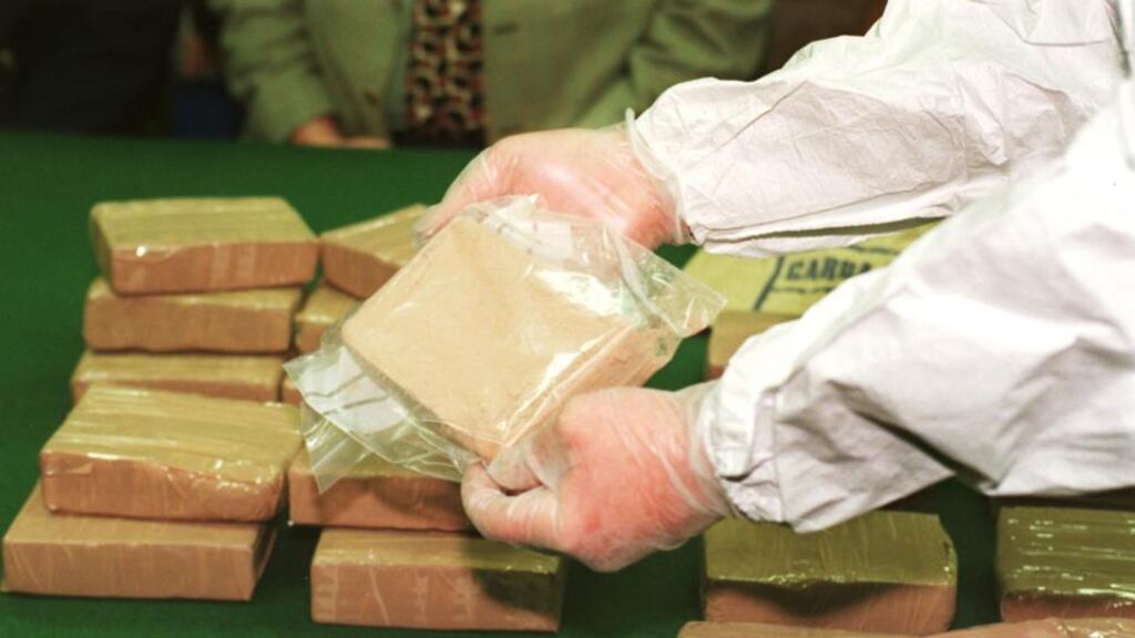 A member of the Garda National Drug Unit, with a section of a large haul of seized heroin. Photograph: Eric Luke