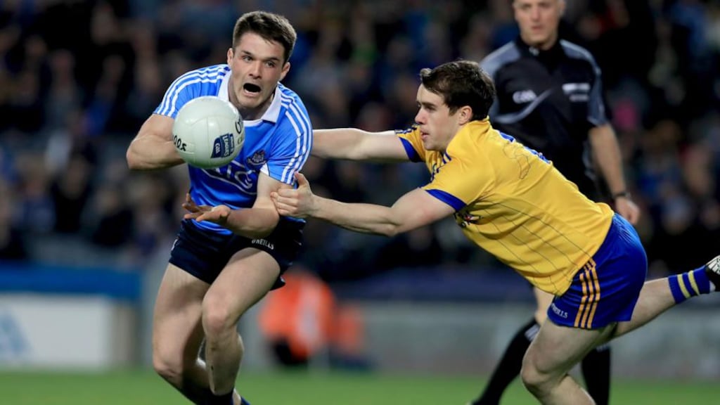Dublin’s Eric Lowndes is tackled by David Murray of Roscommon during the Allianz League Division One game at Croke Park. Photograph: Donall Farmer/Inpho