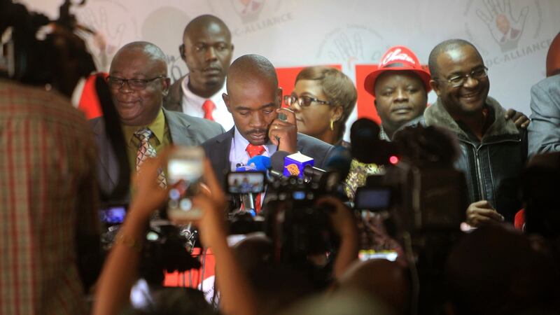 Nelson Chamisa (centre) head of the MDC opposition alliance at the party headquarters in Harare, Photograph: Tsvangirayi Mukwazhi/AP