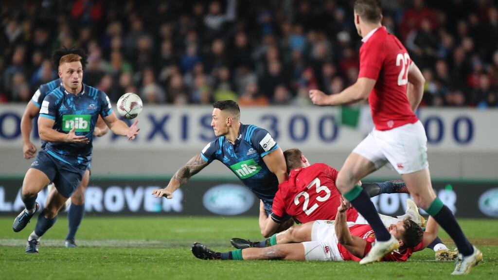 Blues’ Sonny Bill Williams offloads to Ihaia West to set up the winning try in their clash with the Lions at Eden Park. Photo: Peter Meecham/Inpho