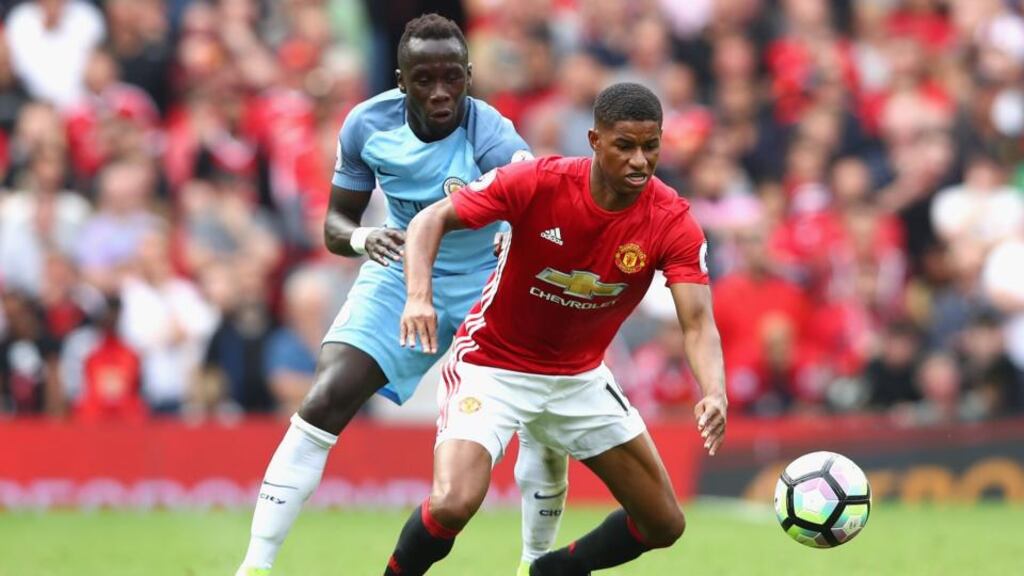 Marcus Rashford of Manchester United is challenged by Bacary Sagna of Manchester City at Old Trafford. United’s revenue is predicted to be £530 million to £540 million at the end of the next financial year. Photograph: Alex Livesey/Getty Images