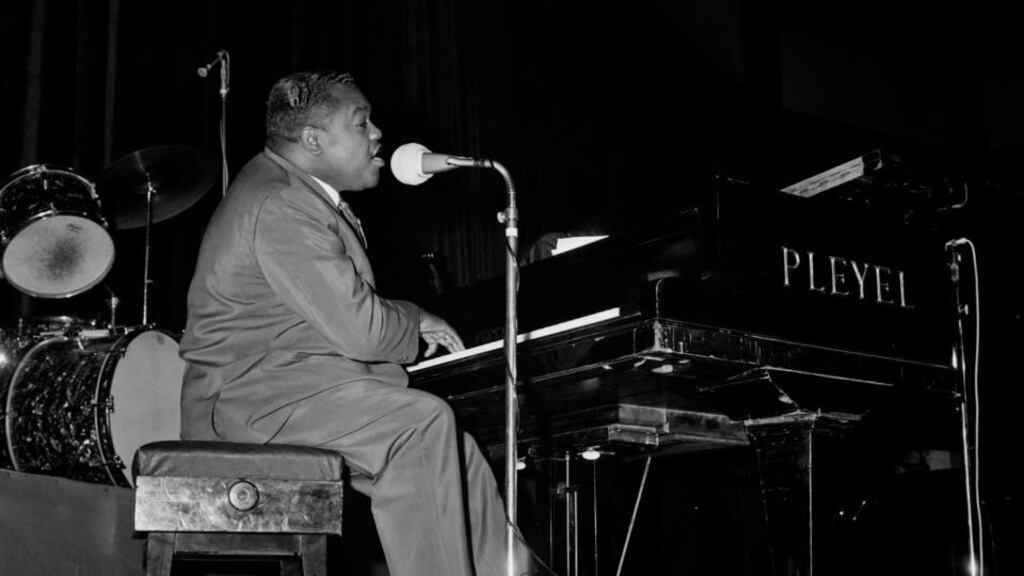 Fats Domino performing in Paris in October 1962. When he toured he took 200 pairs of shoes and 30 suits on the road. Photograph: AFP/Getty Images