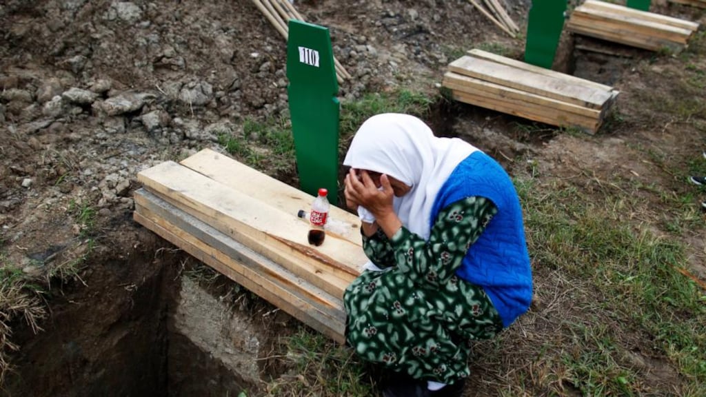 A Bosnian woman cries beside the coffin of a relative, one of the 409 coffins of newly identified victims from the 1995 Srebrenica massacre, in Potocari Memorial Center, near Srebrenica today. Photograph: Dado Ruvic/Reuters