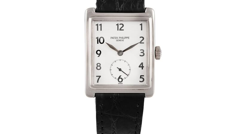 Lot 93, a Gondolo watch by Patek Philippe with a square white face on a black leather strap