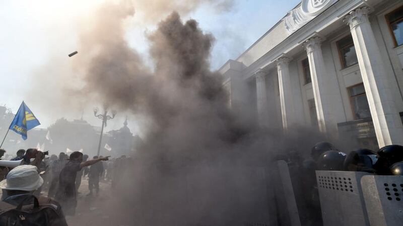 Smoke rises from the parliament building. Photograph: Sergei Supinsky/AFP/Getty Images