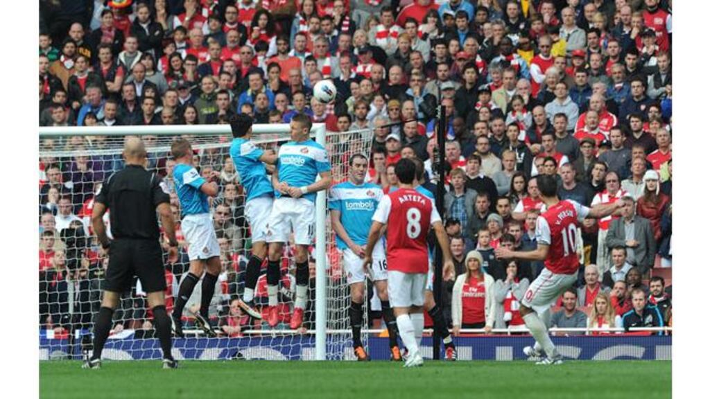 Arsenal's Robin Van Persie (right) scores his second goal and the winner against Sunderland from a free-kick in the second half of the Barclays Premier League clash at the Emirates Stadium. - (Photograph: Anthony Devlin/PA Wire)