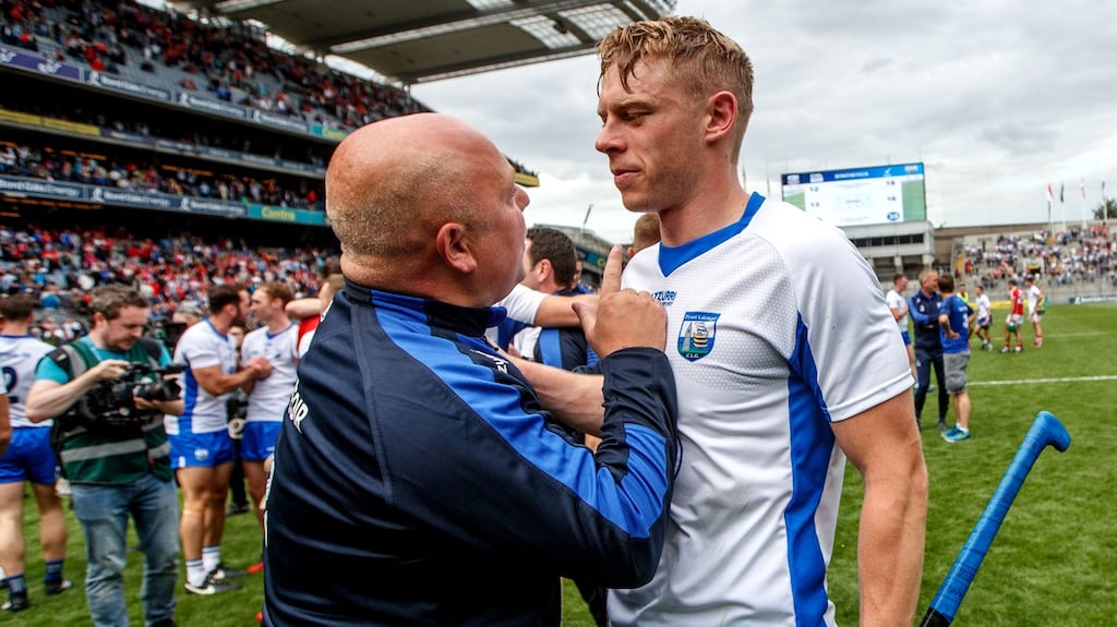 Waterford’s manager, Derek McGrath, celebrates with Philip Mahony after defeating Cork in the All-Ireland semi-final. Photograph: Inpho