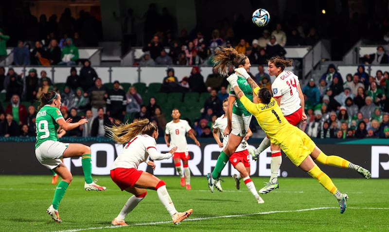 Ireland’s’ Kyra Carusa challenges for the ball with Canada goalkeeper Kailen Sheridan and Vanessa Gilles during the World Cup Group B game at the Perth Rectangular Stadium. Photograph: Ryan Byrne/Inpho