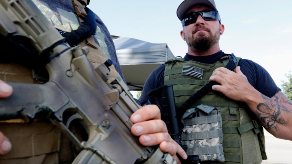 Gun-toting citizens are showing up at military recruiting centres around the US. Photograph: Rose Baca/The Dallas Morning News via AP