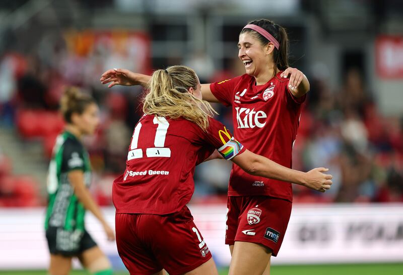 Isabel Hodgson and Erin Healy (right) celebrate Adelaide United's victory in the A-League women's elimination final match against Western United in April. Photograph: Sarah Reed/Getty Images