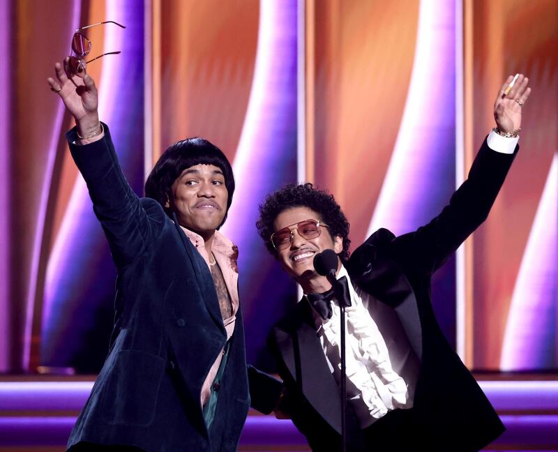 Anderson .Paak and Bruno Mars of Silk Sonic accept record of the year award at the Grammy awards. Photograph: Emma McIntyre/Getty Images for The Recording Academy