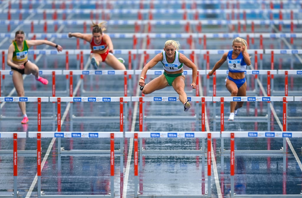 Sarah Lavin of Emerald AC, Limerick (second from right) on her way to winning the the women's 100m hurdles during day one of the 123.ie National Athletics Championships at Morton Stadium in Santry. Photograph: Tyler Miller/Sportsfile
