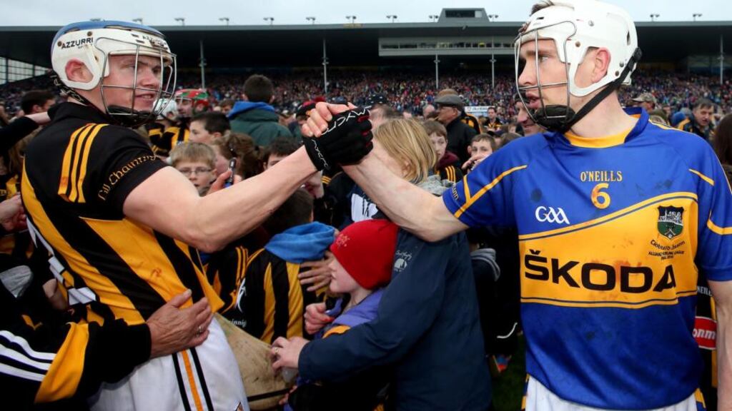 Tipperary’s Brendan Maher exchanges greetings with Kilkenny’s TJ Reid after the National League final in Thurles. Photo: James Crombie/Inpho