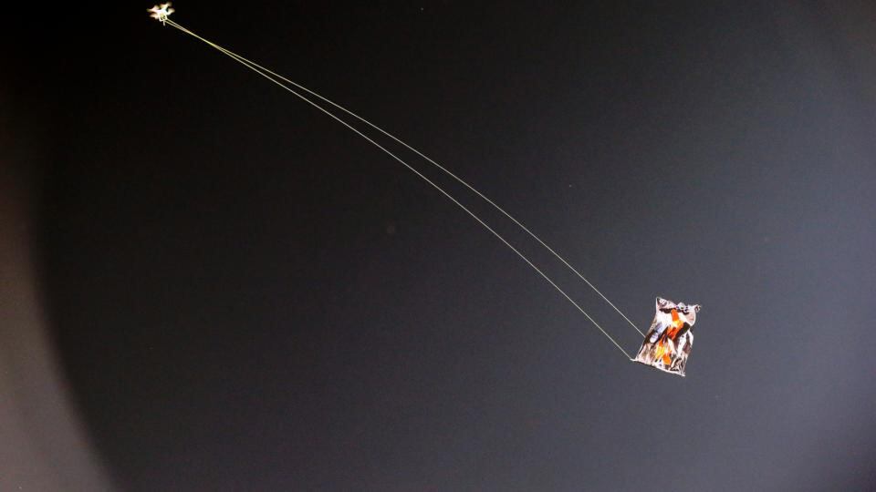 A flag with Albanian symbols is flown over the  Partizan stadium in Belgrade  by a remote-controlled drone  during the Euro 2016 Group I qualifying match between Serbia and Albania. It provoked a fight between players.  Photograph: Srdjan Suki/EPA