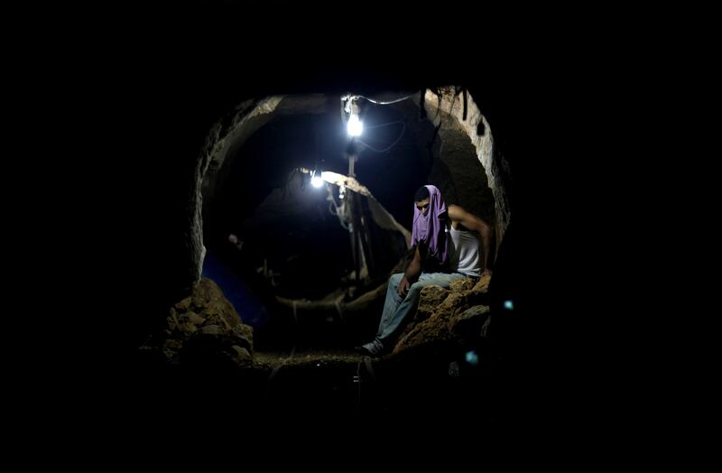 A Palestinian worker photographed in 2013 resting inside a smuggling tunnel in Rafah, on the Gaza-Egypt border. Photograph: Hatem Moussa/AP