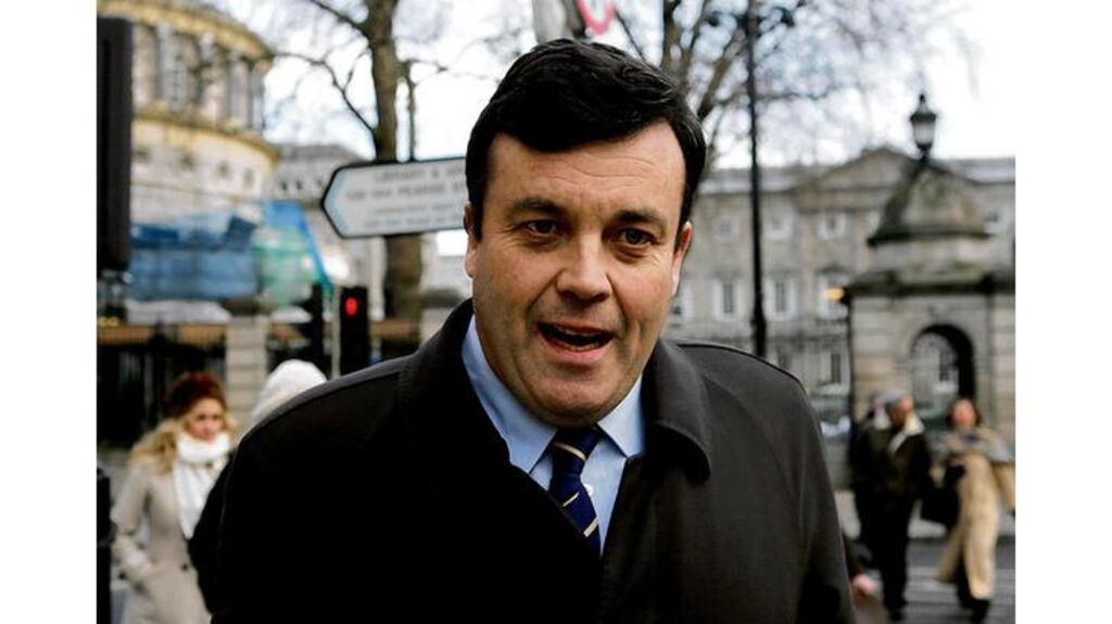 Minister for Finance Brian Lenihan on Molesworth Street, Dublin, yesterday. "I'll be totally focused on doing my job," was his message for journalists. After his lunchtime appearance on RTÉ Radio 1, callers to the following programme, Liveline, praised his bravery and openness.