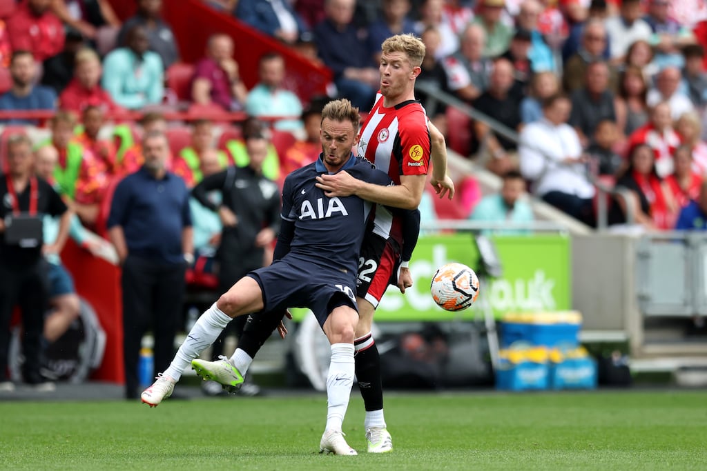 Brentford's Nathan Collins and Tottenham Hotspur's James Maddison (left) battle for the ball during the Premier League match. Photograph: Nigel French/PA Wire