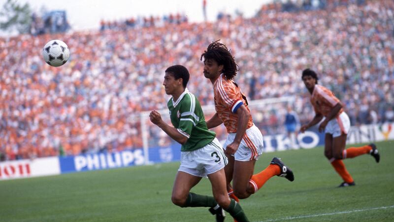 Chris Hughton is pressed by Ruud Gullit during Ireland’s clash with the Netherlands at Euro ’88. Photograph: Billy Stickland/Inpho