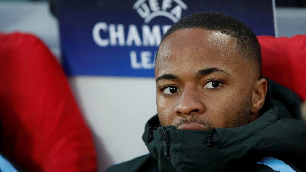 Manchester City’s Raheem Sterling watches Liverpool win from the bench. Photograph: Reuters
