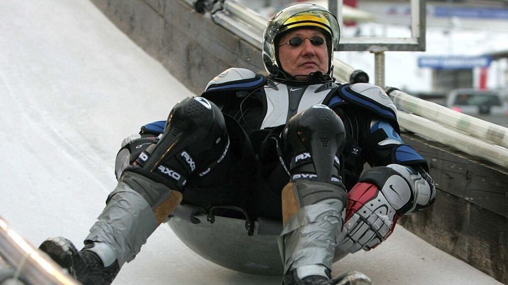 Champion wok racer Stefan Raab shows how it’s done. The sport involves sitting in a round-bottomed Chinese wok and hurtling down a bobsled track. Photograph: Moritz Winde/Getty Images