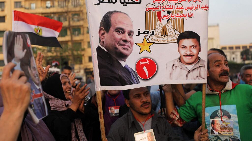 Supporters of Egyptian president Abdel Fatah al-Sisi celebrate in Cairo’s Tahrir square on Monday following his re-election for a second term. Photograph: Mohamed el-Shahed/AFP/Getty Images