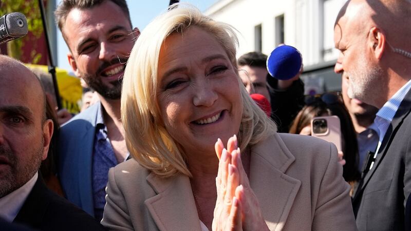 French presidential candidate Marine Le Pen campaigning at a street market in Etaples, northern France. Photograph: Michel Euler/AP Photo