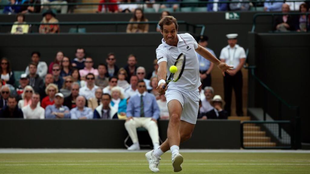 France’s Richard Gasquet returns to Switzerland’s Stan Wawrinka during their men’s quarter-finals match at Wimbledon. Photograph: Adrian Dennis/AFP/Getty Images