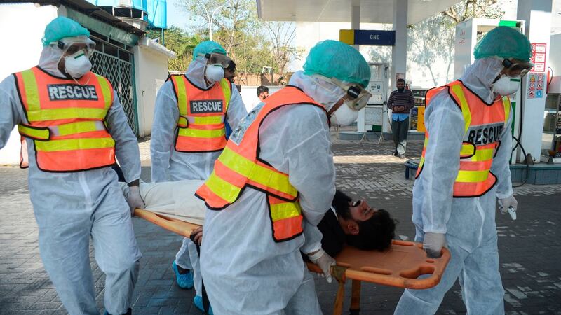 Pakistani rescue personnel take part in drill exercise as a preventive measure for the spread of the of Covid-19 coronavirus, in Peshawar on Sunday as Pakistan has detected two new cases of the novel coronavirus. Photograph: Abdul majeed/AFP via Getty Images