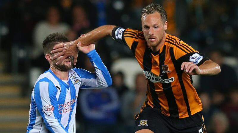 Hull City and Ireland midfielder David Meyler ‘hands off’ Oliver Norwood of Huddersfield Town during their Capital One Cup third round match at the KC Stadium. Photograph: Julian Finney/Getty Images