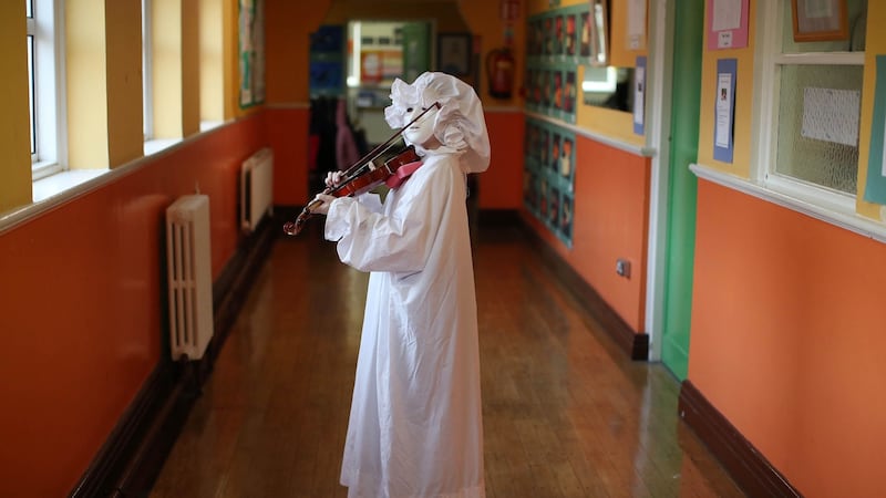 Zach Elliott, from Scoil Úna Naofa Violin and Orchestra Project, rehearses his role of  the ghost in ‘There’s A Ghost in My Living Room’. Photograph: Marc O’Sullivan
