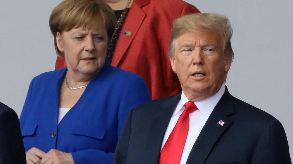 German chancellor Angela Merkel and  US president Donald Trump ahead of  a Nato summit in July. The EU will this week try  to persuade Mr  Trump to abandon  tariffs on EU car-makers.  Photograph: Reuters/Reinhard Krause